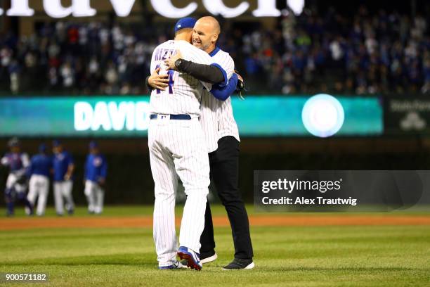 Former Cub David Ross hugs Anthony Rizzo after throwing out the ceremonial first pitch prior to Game 5 of the National League Championship Series...