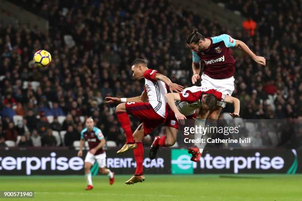Andy Carroll of West Ham United scores his sides first goal during the Premier League match between West Ham United and West Bromwich Albion at...