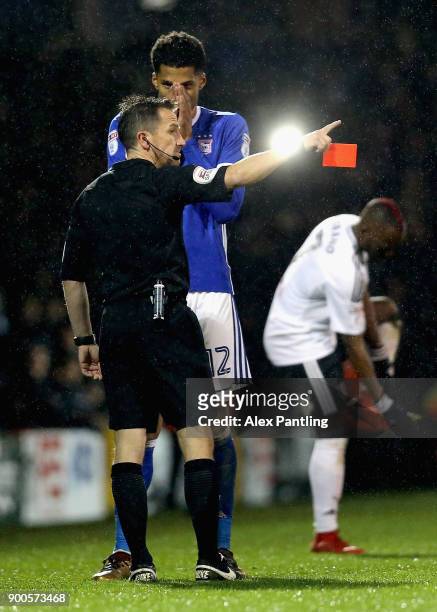 Jordan Spence of Ipswich is shown a red card during the Sky Bet Championship match between Fulham and Ipswich Town at Craven Cottage on January 2,...
