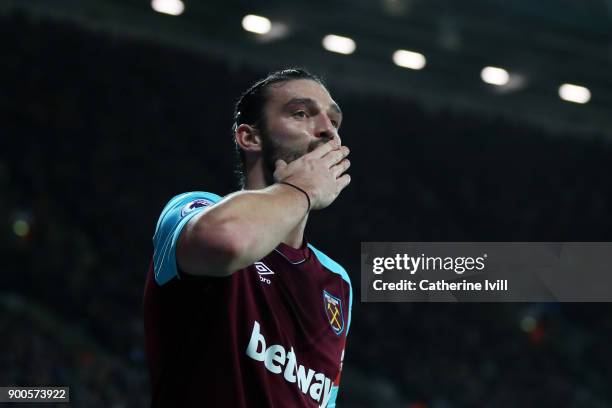 Andy Carroll of West Ham United celebrates after scoring his sides first goal during the Premier League match between West Ham United and West...