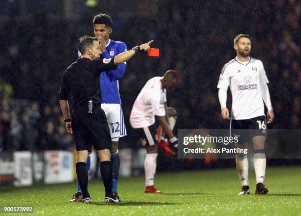 Jordan Spence of Ipswich is shown a red card during the Sky Bet Championship match between Fulham and Ipswich Town at Craven Cottage on January 2,...