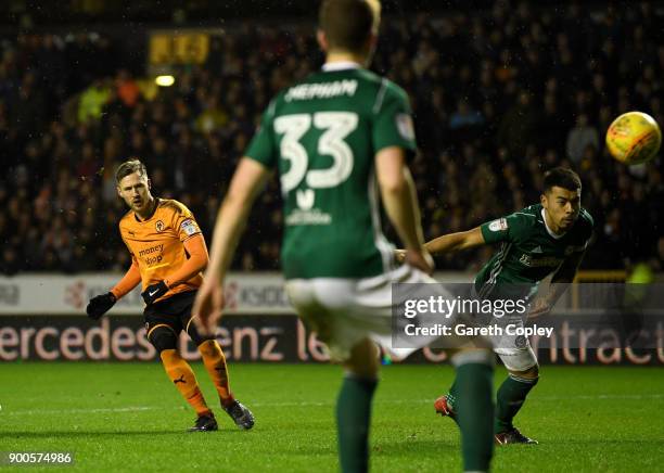 Barry Douglas of Wolverhampton Wanderers scores his team's second goal during the Sky Bet Championship match between Wolverhampton and Brentford at...