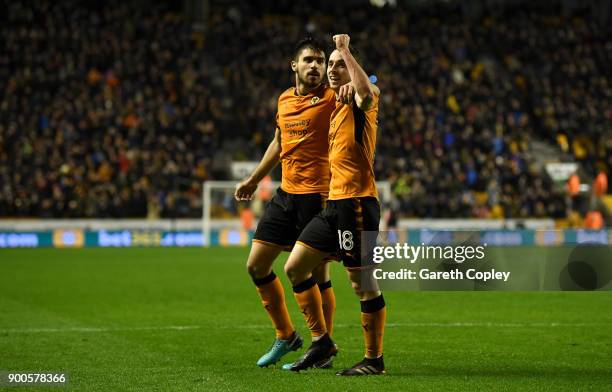 Diogo Jota of Wolverhampton Wanderers celebrates with Ruben Neves of Wolverhampton Wanderers after scoring his team's 3rd goal during the Sky Bet...