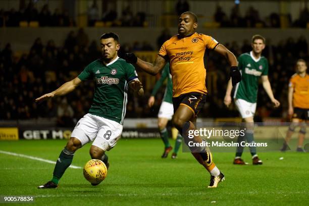 Ivan Cavaleioro of Wolverhampton Wanderers competes with Nico Yennaris of Brentford during the Sky Bet Championship match between Wolverhampton and...