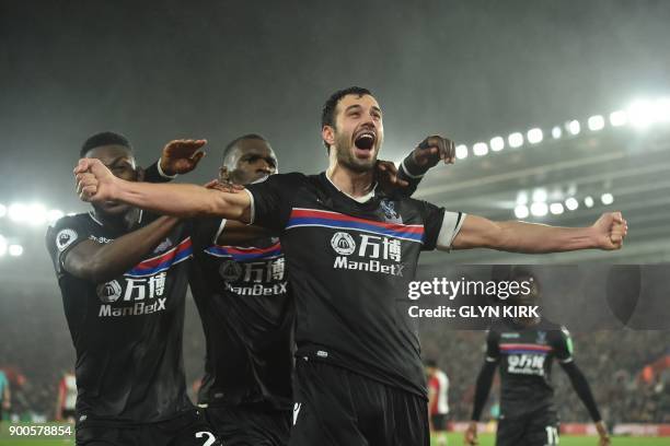 Crystal Palace's Serbian midfielder Luka Milivojevic celebrates after scoring their second goal during the English Premier League football match...