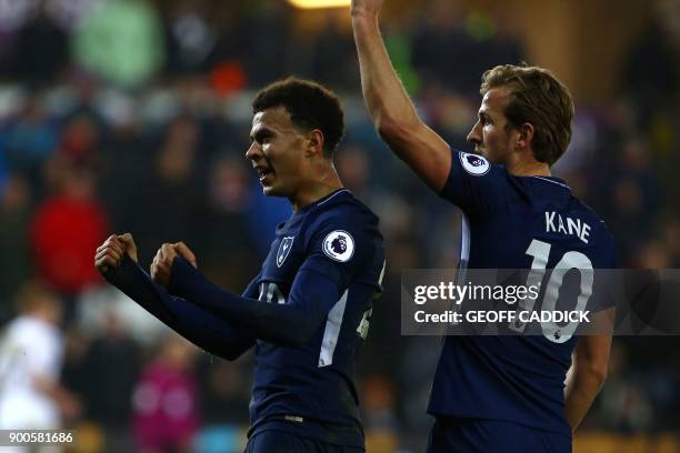 Tottenham Hotspur's English midfielder Dele Alli celebrates with Tottenham Hotspur's English striker Harry Kane after scoring their second goal...