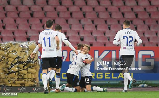 Papu Gomez and Timothy Castagne of Atalanta BC celebrate the 0-2 goal scored by Papu Gomez during the TIM Cup match between SSC Napoli and Atalanta...