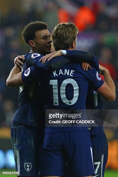 Tottenham Hotspur's English midfielder Dele Alli celebrates with Tottenham Hotspur's English striker Harry Kane and Tottenham Hotspur's South Korean...