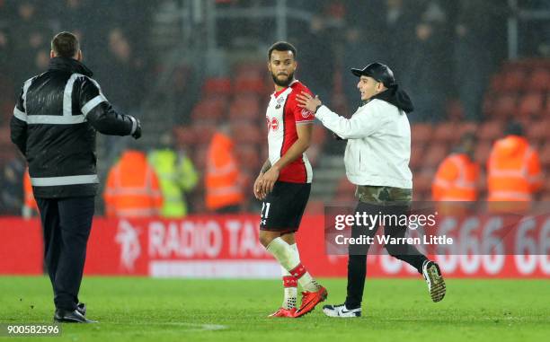 Pitch invador runs to Ryan Bertrand of Southampton after the Premier League match between Southampton and Crystal Palace at St Mary's Stadium on...