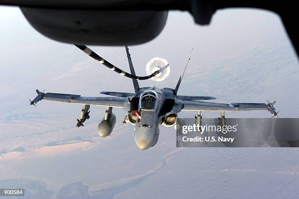 Navy F/A-18 "Hornet" takes on fuel from a U.S. Air Force KC-10 "Extender" November 7, 2001 while flying in support of Operation Enduring Freedom.