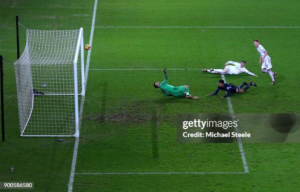 Dele Alli of Tottenham Hotspur scores his sides second goal past Lukasz Fabianski of Swansea City during the Premier League match between Swansea...
