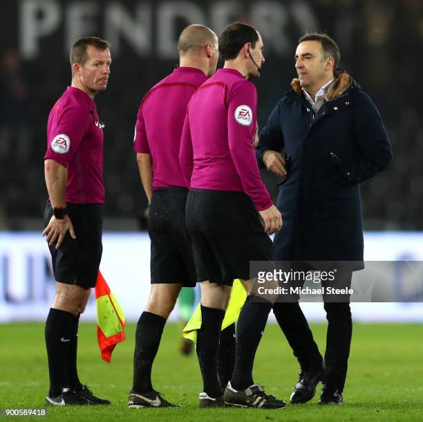 Carlos Carvalhal, Manager of Swansea City argues with referee Bobby Madley after the Premier League match between Swansea City and Tottenham Hotspur...