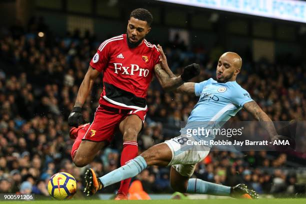 Jerome Sinclair of Watford and Fabian Delph of Manchester City during the Premier League match between Manchester City and Watford at Etihad Stadium...