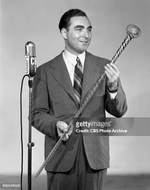 Gold If You Find It, a CBS Radio treasure hunt program. Master of ceremonies James Fleming, poses with glass cane. New York, NY. June 1, 1941.