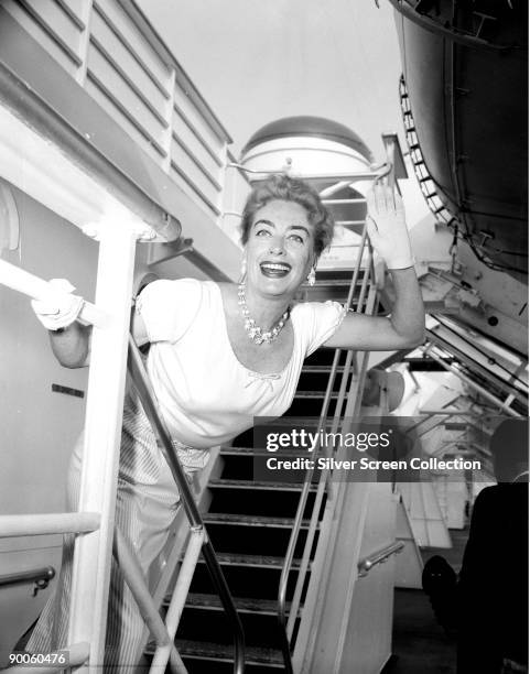 American actress Joan Crawford takes a voyage on a passenger liner, circa 1960.