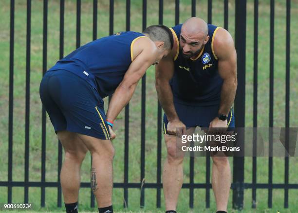 Jarryd Hayne gets encouragment from Club Captain Tim Mannah during a Parramatta Eels NRL pre-season training session at Old Saleyards Reserve on...
