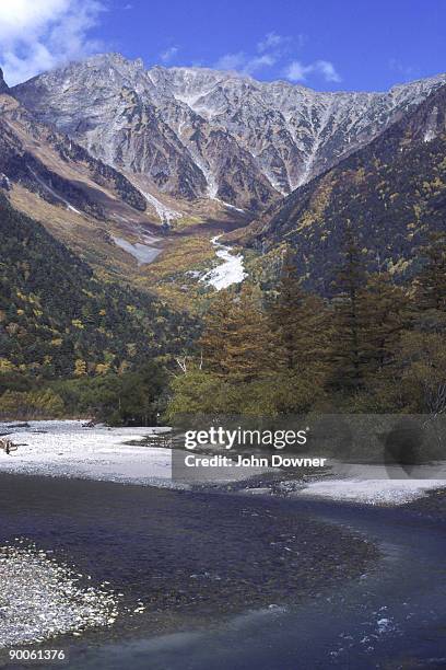 autumn view of hodaka mountains across azusa river - kamikochi national park stock pictures, royalty-free photos & images