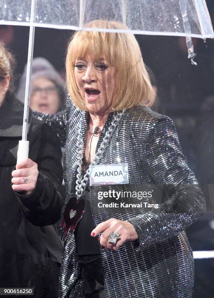 Amanda Barrie enters the Celebrity Big Brother house on launch night at Elstree Studios on January 2, 2018 in Borehamwood, England.