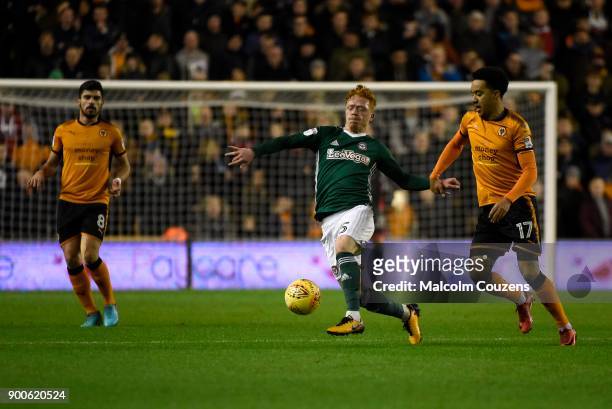 Ryan Woods of Brentford competes with Helder Costa of Wolverhampton Wanderers during the Sky Bet Championship match between Wolverhampton and...