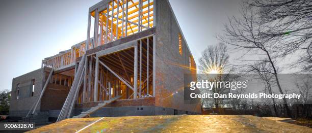 residential house construction at sunset - pano - architecture low angle stock-fotos und bilder