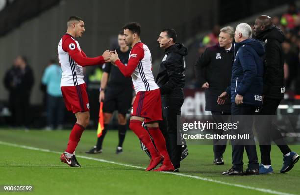 Jake Livermore of West Bromwich Albion is substituted by Hal Robson-Kanu of West Bromwich Albion during the Premier League match between West Ham...