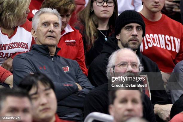 Golfer Andy North and Green Bay Packers quarterback Aaron Rodgers look on during the game between the Wisconsin Badgers and Indiana Hoosiers at the...