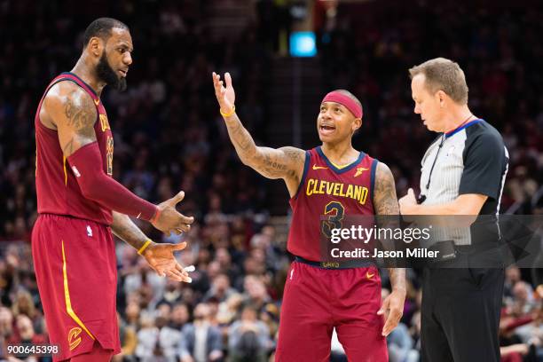 LeBron James an Isaiah Thomas of the Cleveland Cavaliers argue a call with referee Bill Spooner during the second half against the Portland Trail...