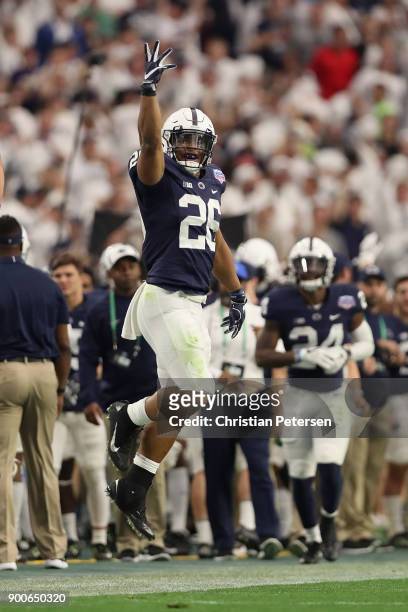 Running back Saquon Barkley of the Penn State Nittany Lions celebrates after scoring on a 92 yard touchdown rush against the Washington Huskies...