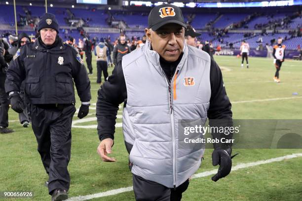 Head coach Marvin Lewis of the Cincinnati Bengals walks off the field following the Bengals win over the Baltimore Ravens at M&T Bank Stadium on...