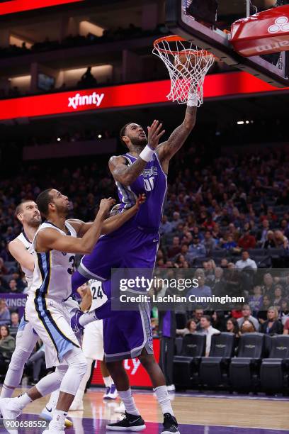 Willie Cauley-Stein of the Sacramento Kings shoots against Brandan Wright of the Memphis Grizzlies at Golden 1 Center on December 31, 2017 in...