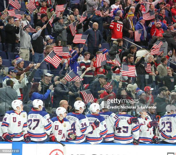 Fans in the Key Bank Center celebrate another team USA win during the final moments of the third period of play in the Quarterfinal IIHF World Junior...