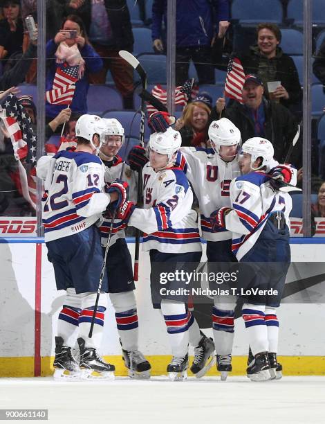 Kieffer Bellows of United States celebrates his second goal of the game against team Russia with his teammates Dylan Samberg, Phil Kemp, Ryan...