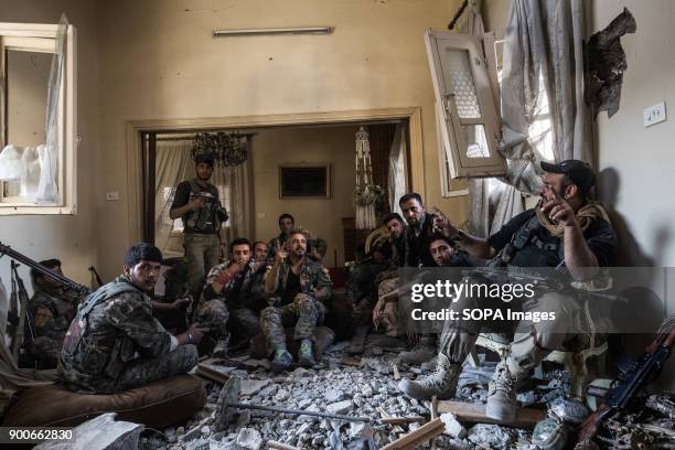 Qamishlo unit of SDF fighter are taking a rest before a new attack at the evening. The Syrian civil war has been carried on for more than 6 years and...