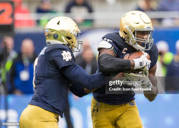 Notre Dame Fighting Irish quarterback Brandon Wimbush hands off the ball during the Citrus Bowl between the Notre Dame Fighting Irish and LSU Tigers...