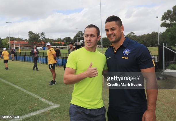 Jarryd Hayne poses for a photo with a fan after holding a press conference at Parramatta Eels training at Old Saleyards Reserve on January 3, 2018 in...