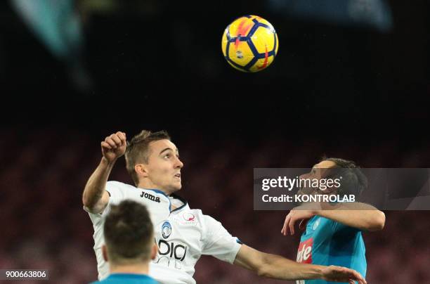 Napoli's Portuguese defender Mario Rui and Atalanta'a French defender Timothy Castagne fight for heading the ball during the Italian TIM Italy Cup...