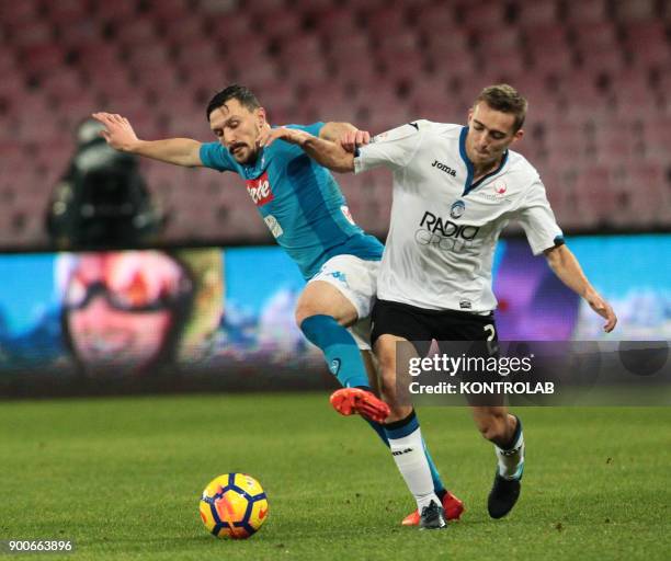 Napoli's Portuguese defender Mario Rui fights for the ball with Atalanta'a French defender Timothy Castagne during the Italian TIM Italy Cup football...