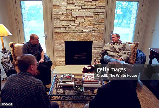 President George W. Bush and Russian President Vladimir Putin begin their first meeting inside a guest room of the Bush Ranch November 14, 2001 in...