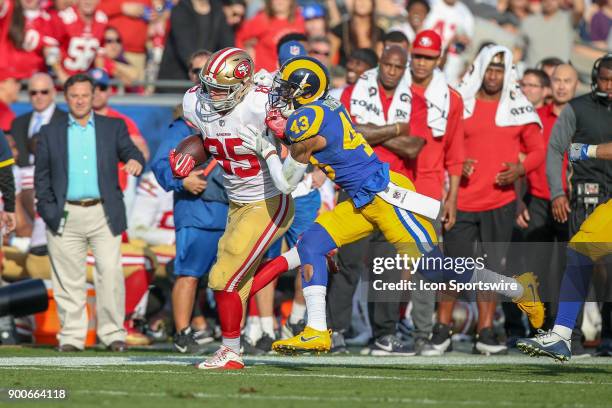 George Kittle of the San Francisco 49ers runs for a gain during an NFL game between the game between the San Francisco 49ers and the Los Angeles Rams...
