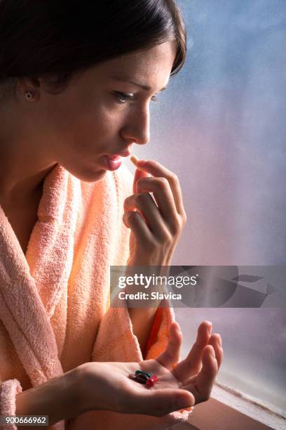 woman taking pills in the hospital - robe 2017 stock pictures, royalty-free photos & images