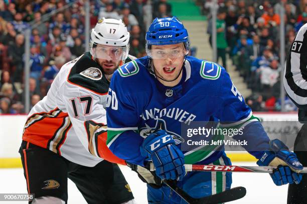 Ryan Kesler of the Anaheim Ducks checks Brendan Gaunce of the Vancouver Canucks during their NHL game at Rogers Arena January 2, 2018 in Vancouver,...