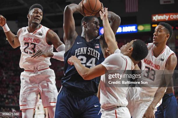 Penn State's Mike Watkins grabs a rebound as he is surrounded by, from left, Maryland's Bruno Fernando, Anthony Cowan Jr., and Joshua Tomaic in the...