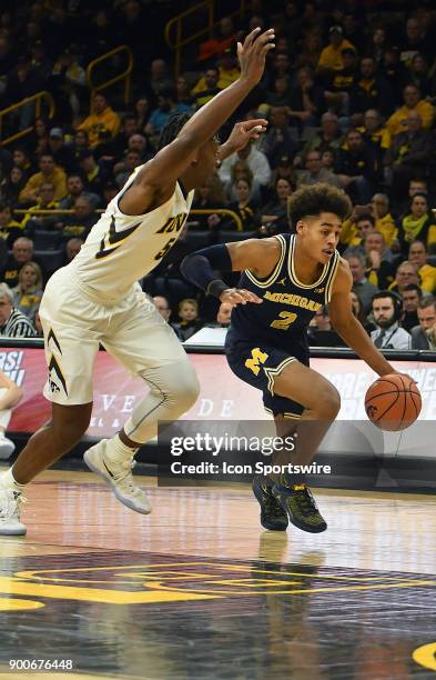 Michigan guard Jordan Poole drives to the basket in the first half during a Big Ten Conference basketball game between the Michigan Wolverines and...