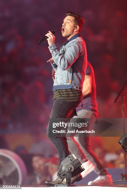 Andy Grammer performs during the halftime show of the 2017 Capital One Orange Bow game between the Miami Hurricanes and the Wisconsin Badgers at Hard...