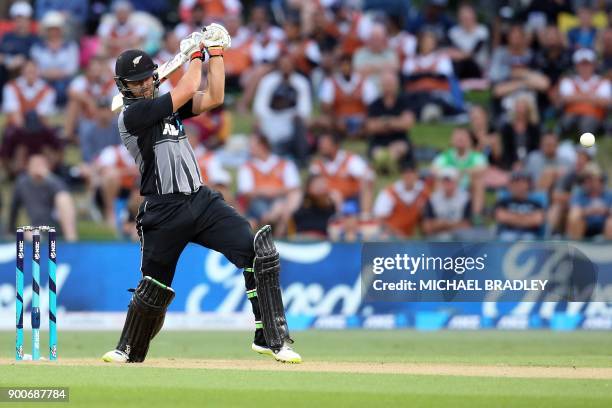 New Zealand's Tom Bruce plays a shot during the third Twenty20 international cricket match between New Zealand and the West Indies at Bay Oval in...