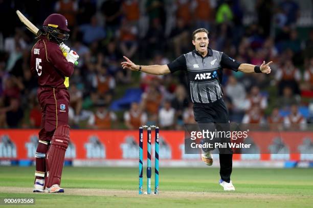 Tim Southee of the New Zealand Black Caps bats celebrates his wicket of Chris Gayle of the West Indies during game three of the Twenty20 series...