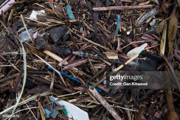 Plastics and other detritus line the shore of the Thames Estuary on January 2, 2018 in Cliffe, Kent. Tons of plastic and other waste lines areas...