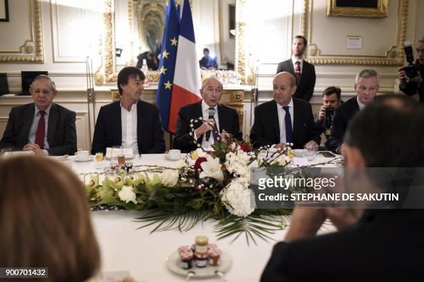 French Interior Minister Gerard Collomb speaks as French Foreign Affairs Minister Jean-Yves Le Drian , French Economy Minister Bruno Le Maire ,...
