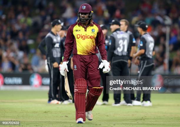 West Indies batsman Chris Gayle walks off the field after he was dismissed during the third Twenty20 international cricket match between New Zealand...