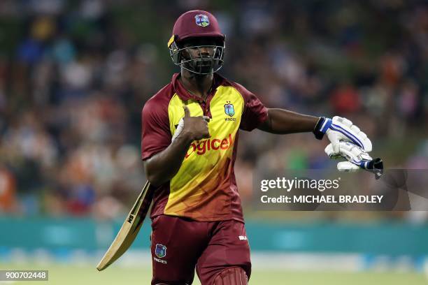 West Indies batsman Chadwick Walton walks off the field after he was dismissed during the third Twenty20 international cricket match between New...